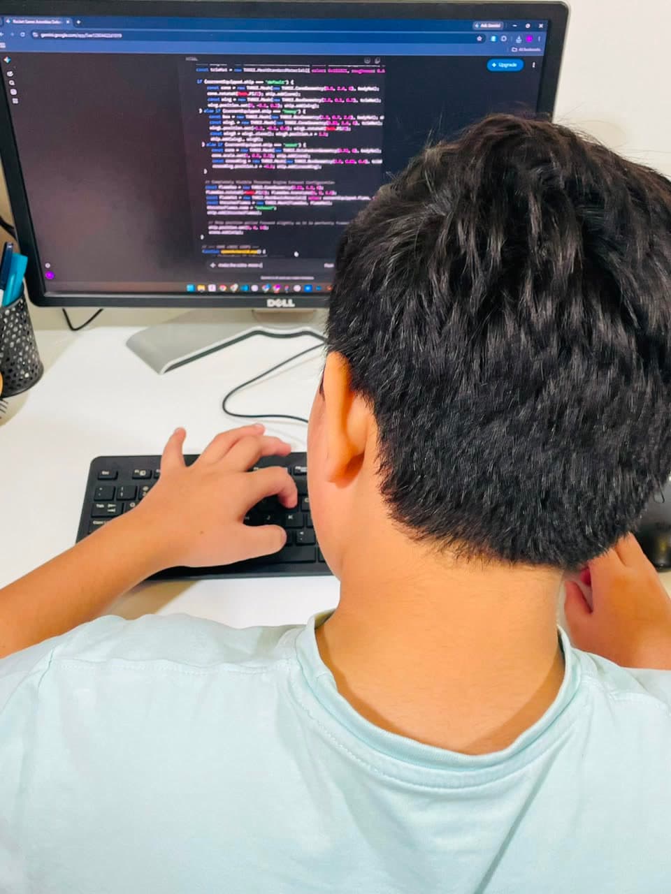 A student working through a build alongside an AI assistant on screen