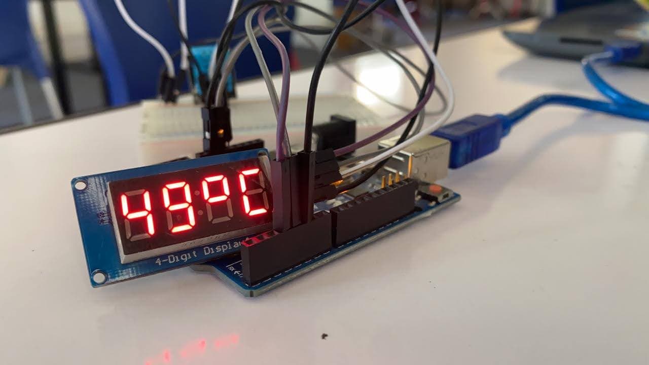 An Arduino 4-digit display showing a live temperature reading